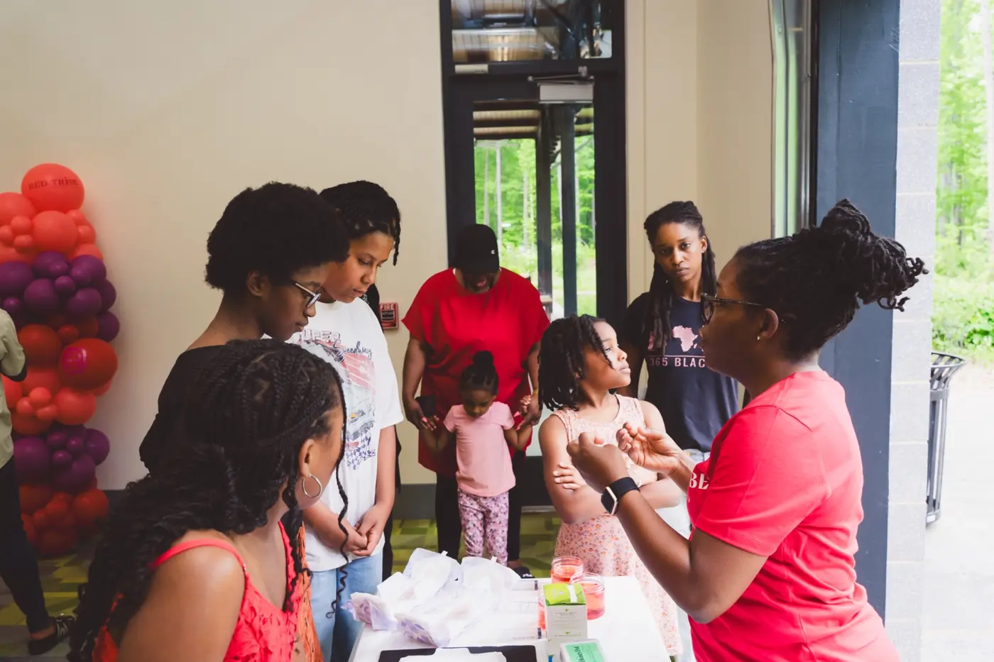 Girls and trusted adults participating together in a hands-on RTC learning session
