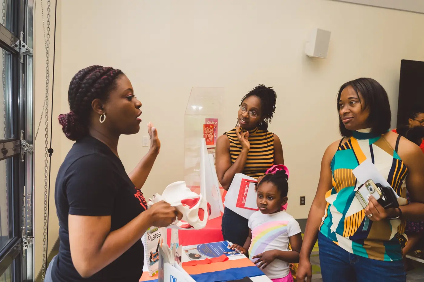 Mothers and girls participating in a facilitated Red Tribe Community learning experience