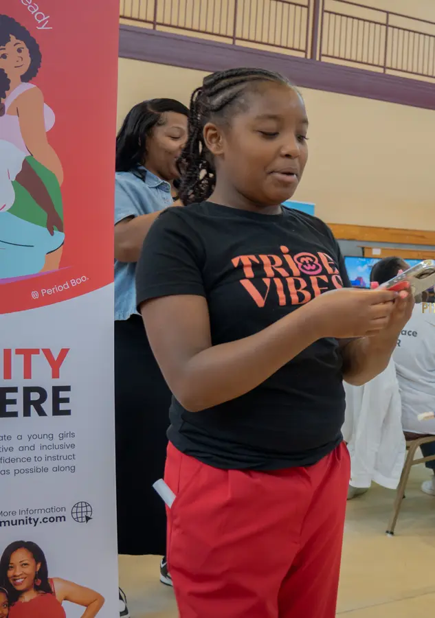 Vivi connecting with a girl at a community gathering